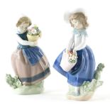 Two Lladro porcelain figures, each holding a basket, numbered 5222 and 5223 respectively.