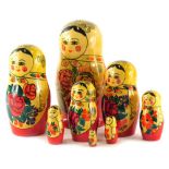 A set of Russian painted dolls, the largest 20cm high.