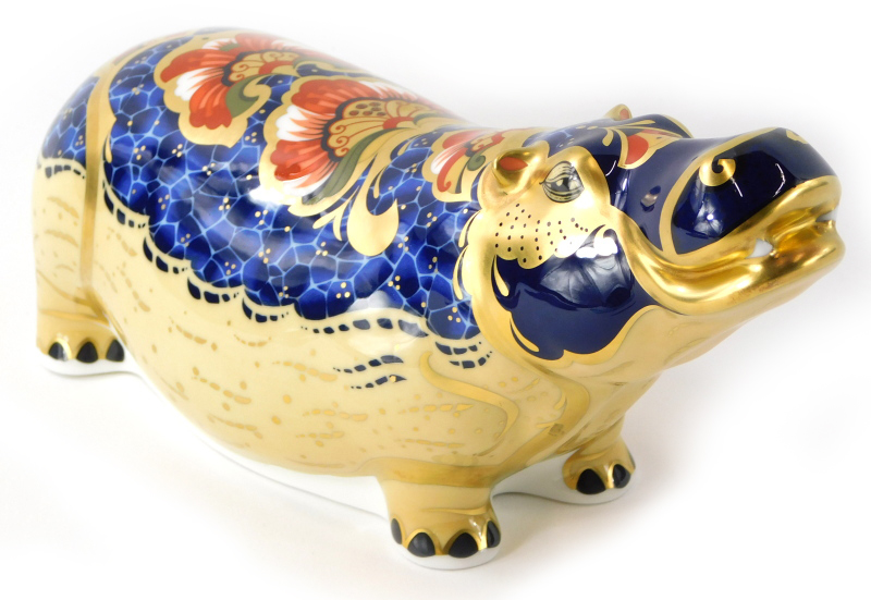 A Royal Crown Derby porcelain paperweight of a hippopotamus, exclusive gold edition number 916 of 25