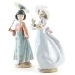 A Lladro porcelain figure of a young lady holding a parasol, number 6156, and another lady with a ba