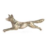 An early 20thC white metal model of a fox, 4.5cm long.