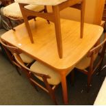 A mid 20thC teak extending dining table, the top 105cm x 85cm, and a set of four associated chairs,