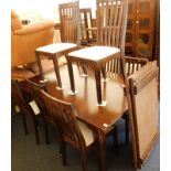 A Laura Ashley hardwood extending dining table, the top 175cm x 118cm, and eight associated chairs,