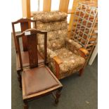 Two oak framed dining chairs, with drop in leatherette seats, and a floral patterned armchair. (3) T