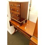 A mahogany sofa table, with two frieze drawers and harp shaped supports, and a mahogany four drawer