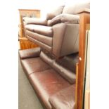 A brown leather three seater sofa, and another two seater sofa. (2)