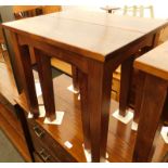 A Laura Ashley hardwood nest of two tables, the largest 52cm high, the top 52cm x 42cm.