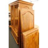 A Barker and Stonehouse hardwood double wardrobe, with four drawers to the base, on bun feet, and a