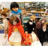 A collection of bisque face dolls, to include a child in a Sherlock Holmes type cape and hat, Little