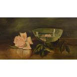 Edwardian School. Still life, bowl and rose head on a table, oil on canvas, unsigned, 25cm x 44cm.