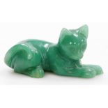 A carved green stone figure of a seated cat, 8cm wide.