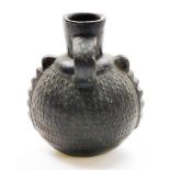 A Chinese pottery ovoid ewer with single handle and relief decorated body, 19thC or earlier, 20cm hi