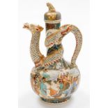 A Meiji period Japanese Satsuma ewer and cover with dog of fo knop, a sinuous dragon forming the han