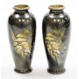 A pair of Japanese bronze vases, each with etched designs of pavilions in mountainous landscape, sil