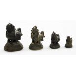 A set of four graduated Chinese bronze opium weights modelled as Dogs of Fo, the largest 7cm high, t