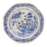 A Chinese blue and white octagonal plate, decorated with the Willow pattern within butterfly and dia