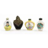 A group of four Chinese snuff bottles, to include three ceramic examples, two with figures one with
