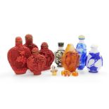 Three Chinese overlay glass snuff bottles and others, including four moulded composite bottle