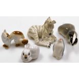 A group of five Russian porcelain figures, to include a seated zebra with red USSR stamp to undersi