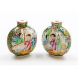 A pair of Canton snuff bottles, each decorated with figures, birds and flowers, 6cm high. (AF)