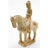 A Chinese Tang style pottery figure of a man on horseback, rectangular base, probably of the period,