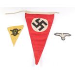 A Third Reich Swastika car pennant, red ground, 32cm wide, a WWII SS Uniform badge, and a Poison Gas