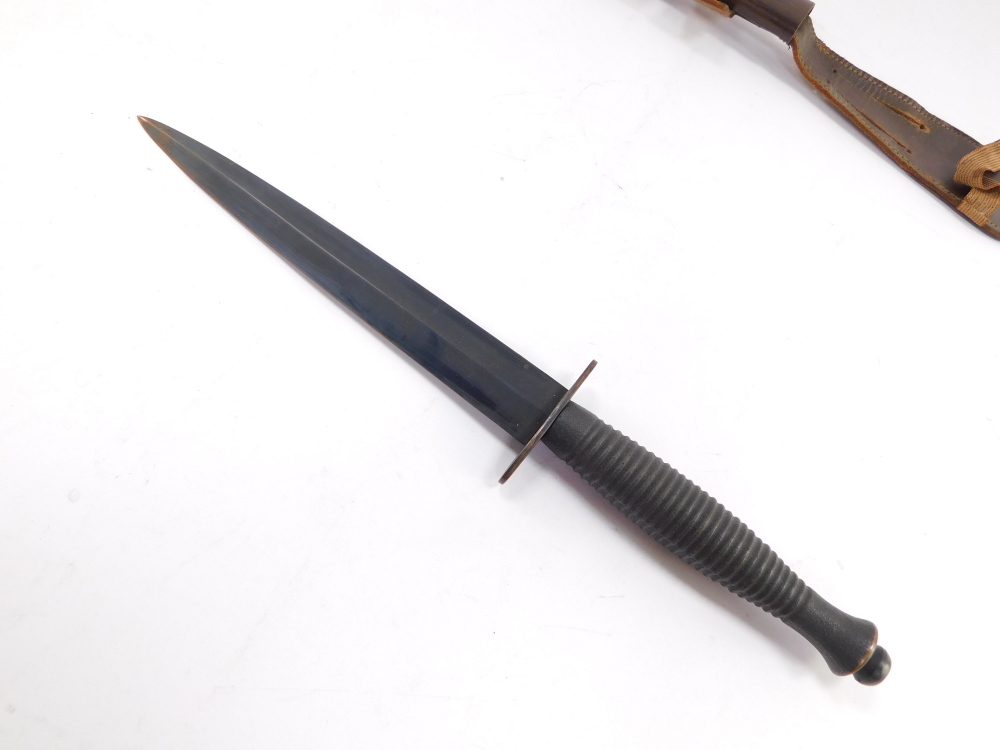A Fairbairn Sykes Commando knife, with a foiled grip, leather sheath, 31cm high. - Image 2 of 3