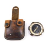 A Russian Adrianov Soviet Army Military orienteering compass, with a leather carrying wallet.