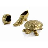 Three brass ornaments, comprising a fish, turtle trinket box and a boot. (3)