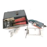 A Bosch electrical belt sander, GBS 75AE, boxed, with accessories.
