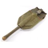 An American entrenching spade and cover, dated 1944.