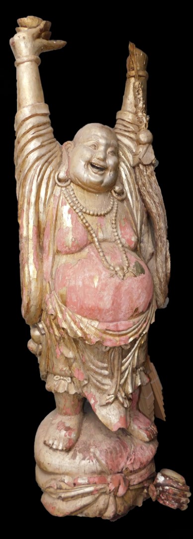 A lifesize gilt wood figure of Buddha, modeled standing with his hands raised, a necklace about his