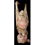 A lifesize gilt wood figure of Buddha, modeled standing with his hands raised, a necklace about his