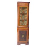 An Edwardian Sheraton Revival satinwood and painted corner display cabinet, painted with floral swag