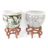 A near pair of Chinese porcelain jardinieres or goldfish bowls, each predominantly decorated with fl