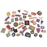 A collection of military cloth badges. (a quantity)