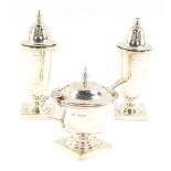 A silver three piece condiment set, of Neo Classical form, comprising mustard pot with spoon and blu