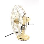 A Limit early 20thC electric fan, raised on a cream painted cast iron stand, Patent No 662079, etc.,