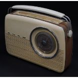 A Bush brown and cream Bakelite radio, type VTR103, serial number 462/27094, 33cm wide.