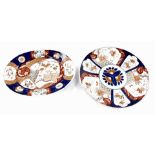 A Japanese Meiji period porcelain Imari dish, of oval form, painted with reserves of flowers and in