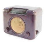 A Bush brown Bakelite radio, type DAC90A, serial number 73/185300, 30.5cm wide.