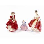 Three Royal Doulton porcelain figures, comprising Top O' The Hill. HN1834, Dinky Do. HN1678, and Sou