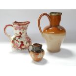 A group of ceramics, comprising a Masons jug, a miniature Doulton Lambeth jug, and a Doulton Lambeth