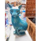 A Poole Pottery figure of a standing cat, in blue glazed finish.