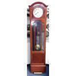 A 1930s mahogany longcase clock, with glazed door, brass weights and pedulum, a German two-train mov