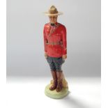 A Coalport Royal Canadian mounted police figure, limited edition No 85/950.