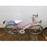 A Raleigh Prima child's bicycle, pink frame.