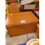 An early 20thC rectangular oak box, the hinged lid enclosing a vacant interior, 34cm wide.