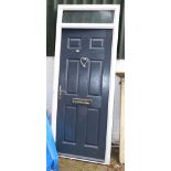 A UPVC front door with frame and keys.