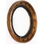 A 19thC giltwood port hole mirror, repainted, 49cm diameter.